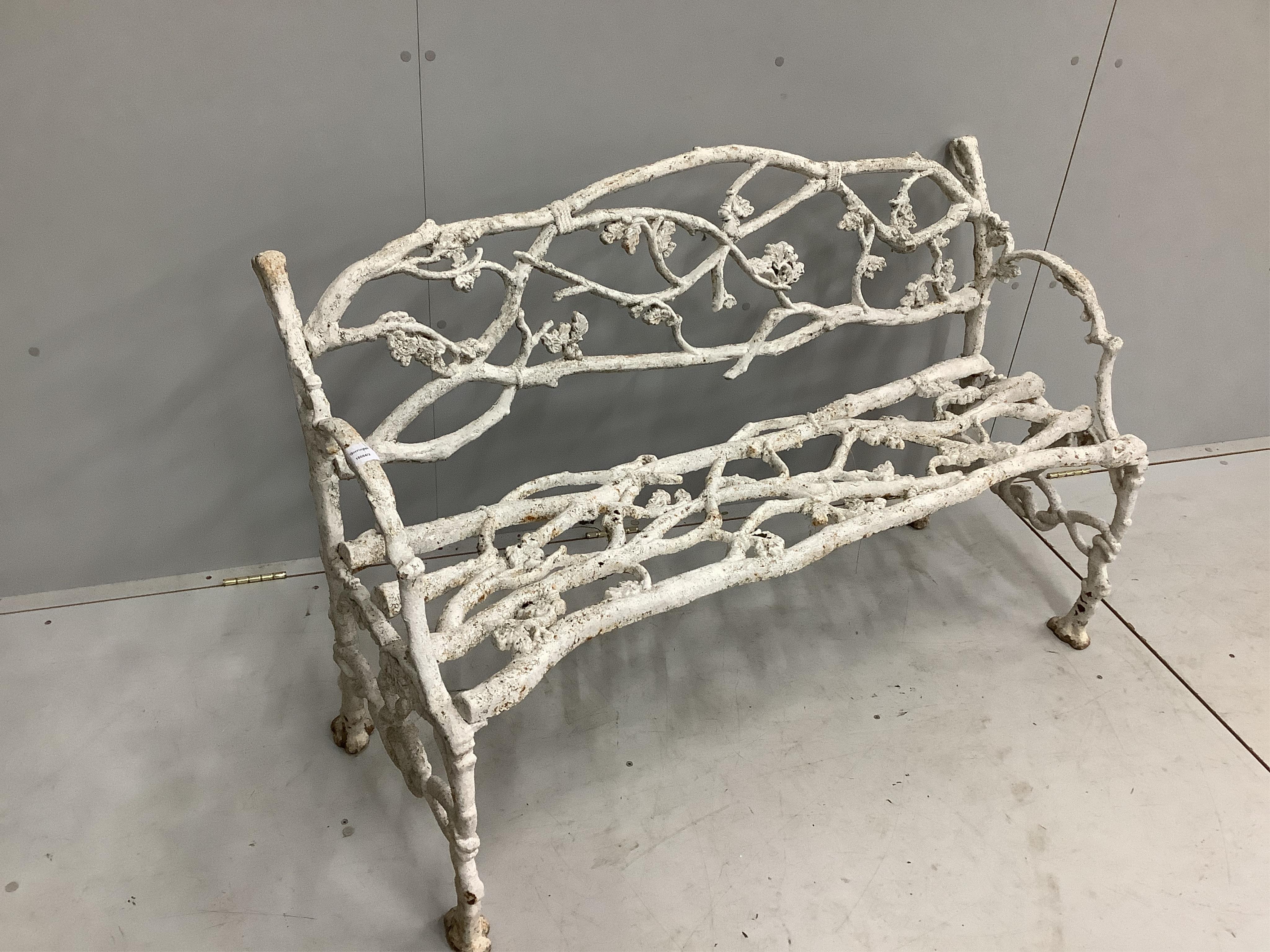 A Victorian Coalbrookdale style cast iron branch pattern garden bench, width 128cm, depth 50cm, height 78cm. Condition - fair